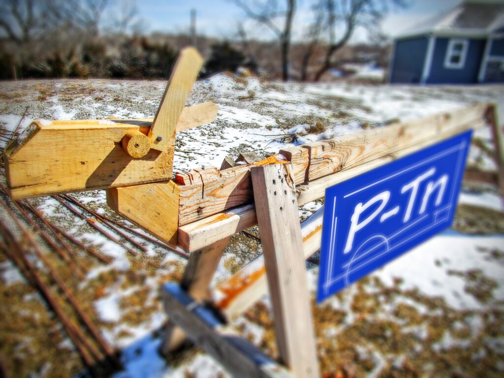high school student-built saw horse sitting on vacant lot | P-Tn