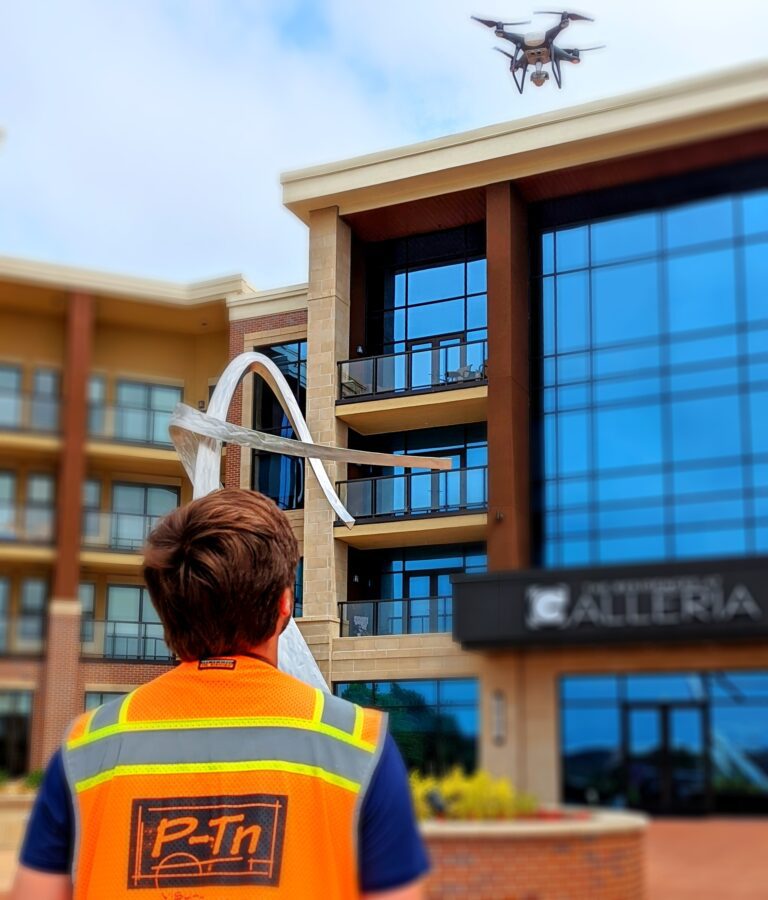 drone pilot flying near a modern sculpture in Overland Park Kansas | P-Tn