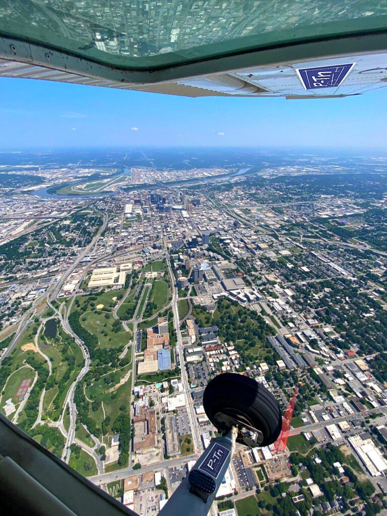 May contain an aerial view from an airplane of the Kansas City, MO downtown area. | P-Tn