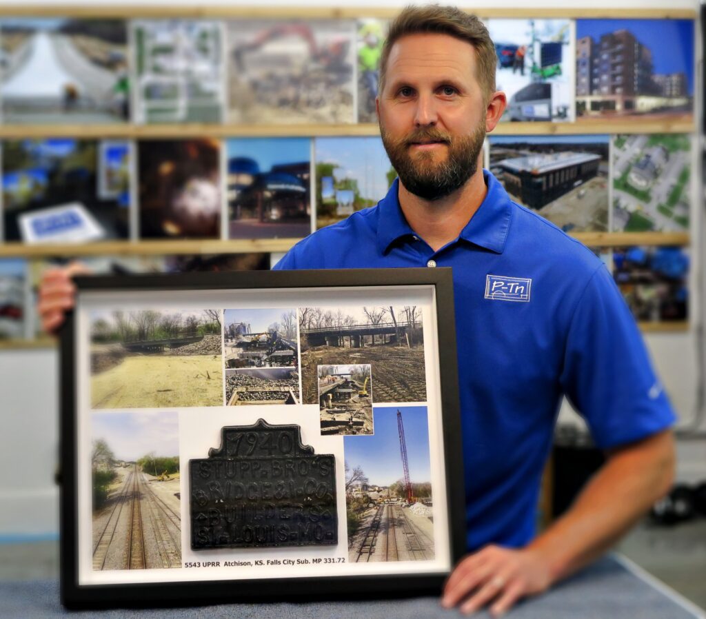 May contain P-Tn employee holding a finished shadow box. | P-Tn