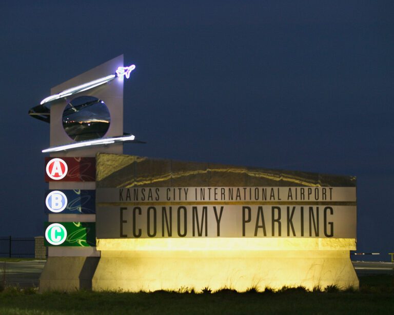 Airport ECONOMY PARKING sign at night | P-Tn.com